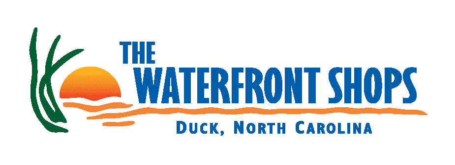 The Waterfront Shops Duck, North Carolina with a water plant in front of a sunset.