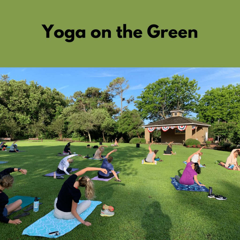Yoga on the Green. Photo of people practicing yoga on a lawn.